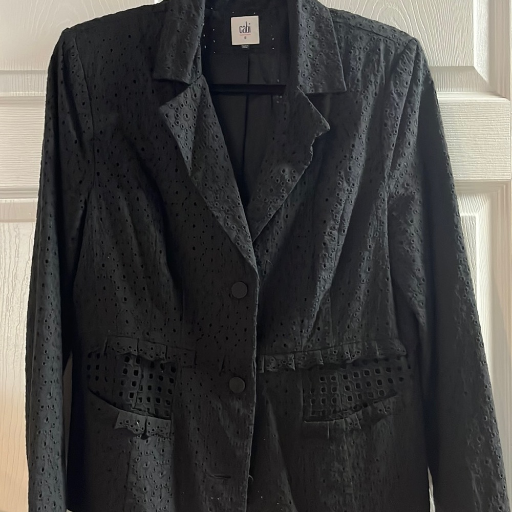 Eyelet jacket. Peplum,  ruffle detail, 2 pockets